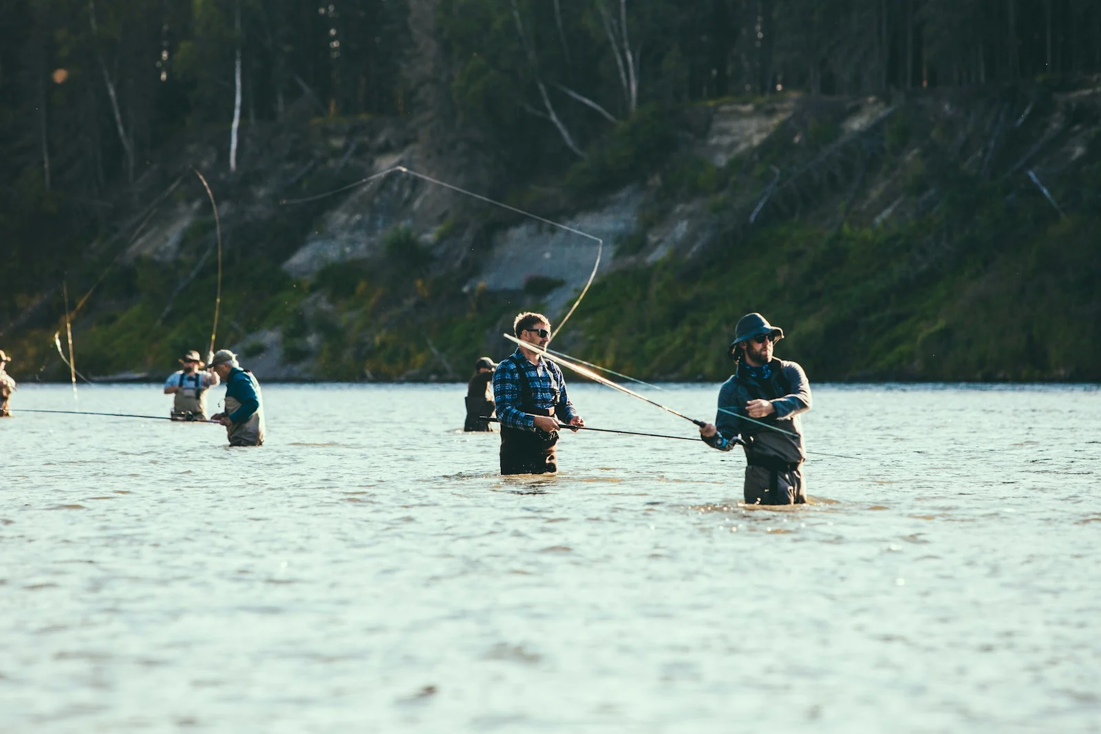 people riding on boat on lake during daytime