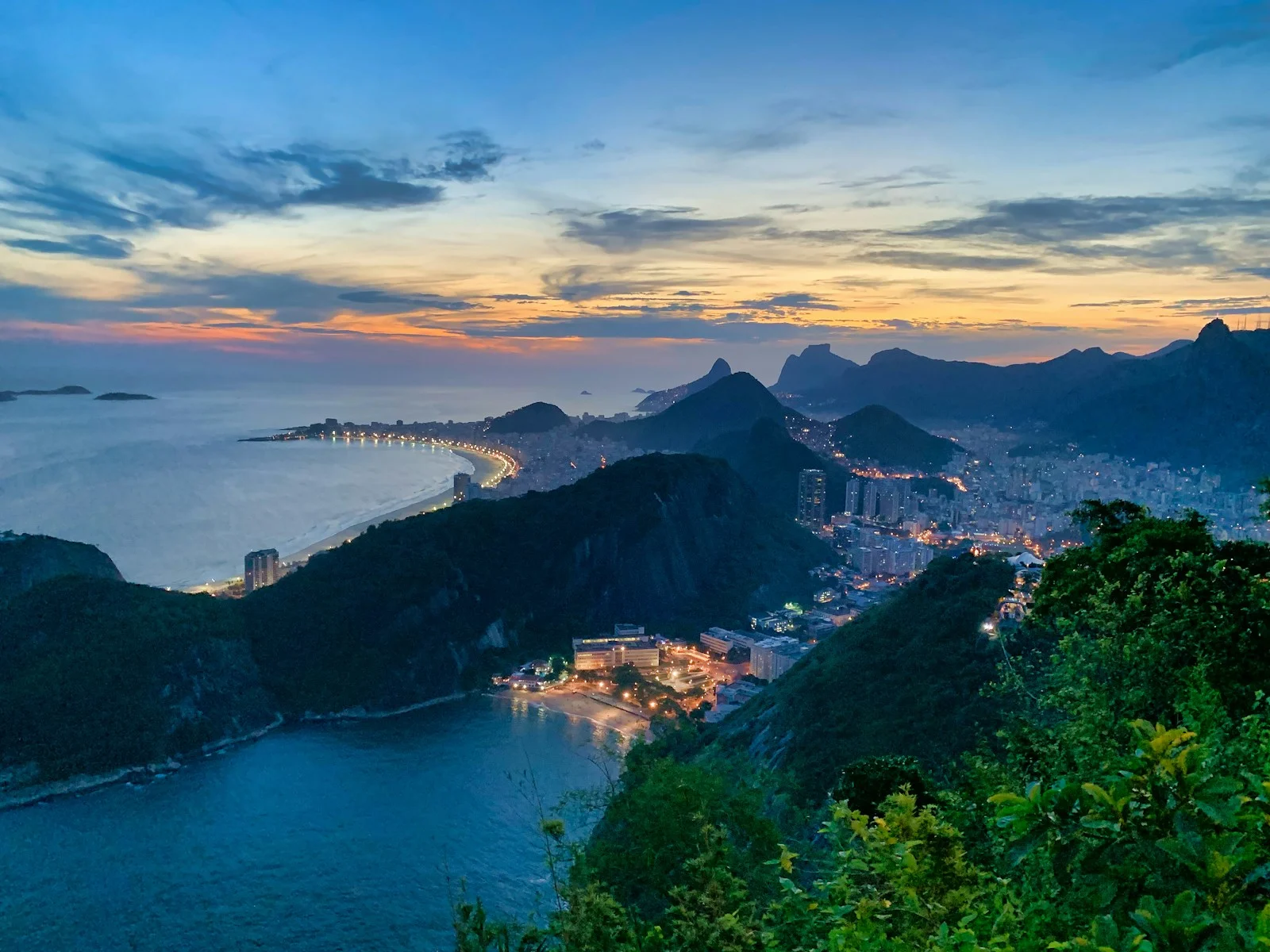 aerial photography of mountains surrounded by sea