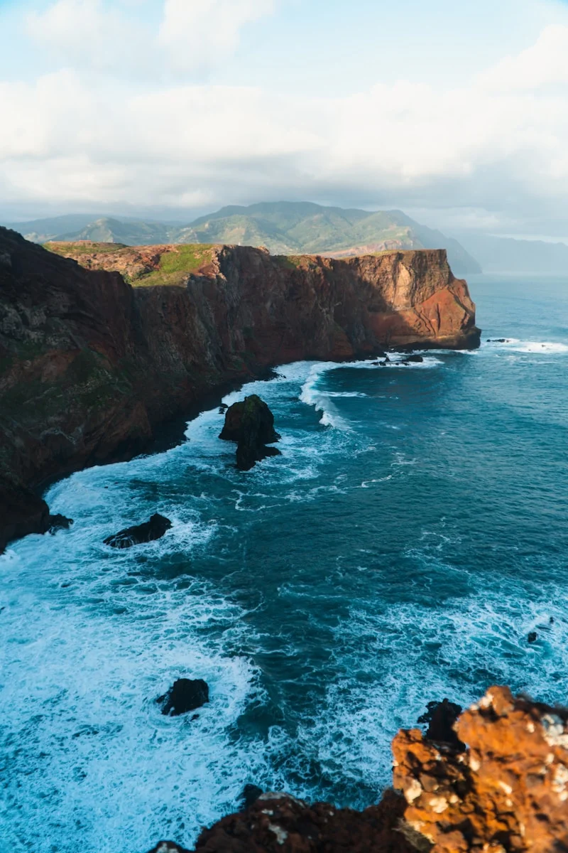 a view of the ocean from the top of a cliff
