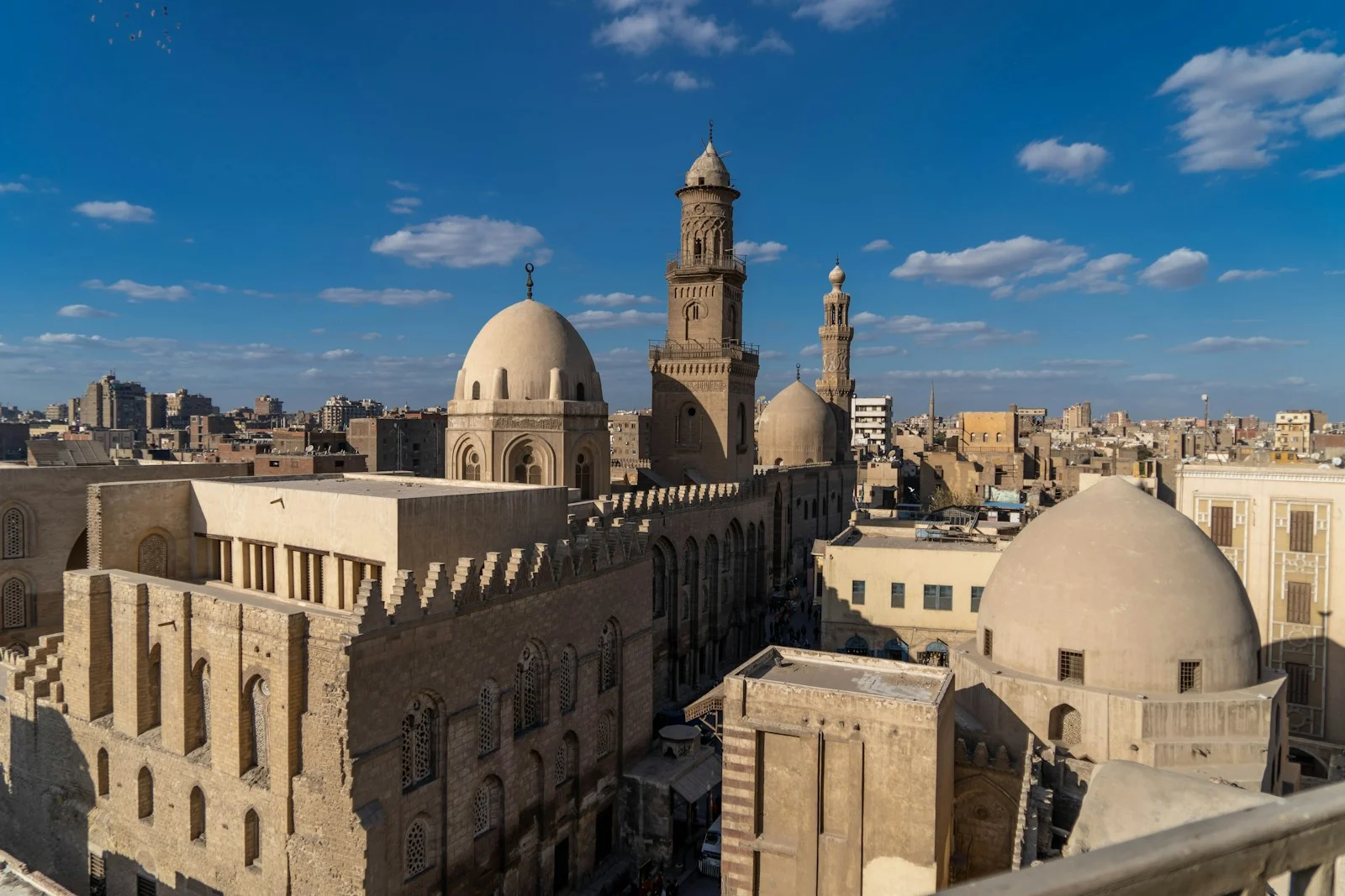 a view of a city from a rooftop of a building