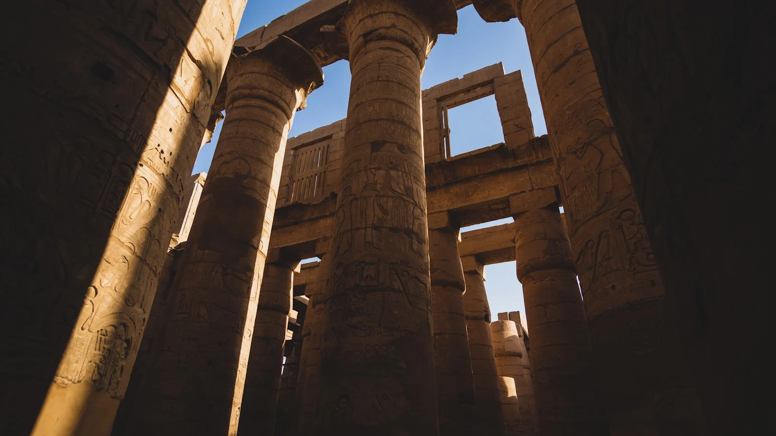 the columns of a building with writing on them