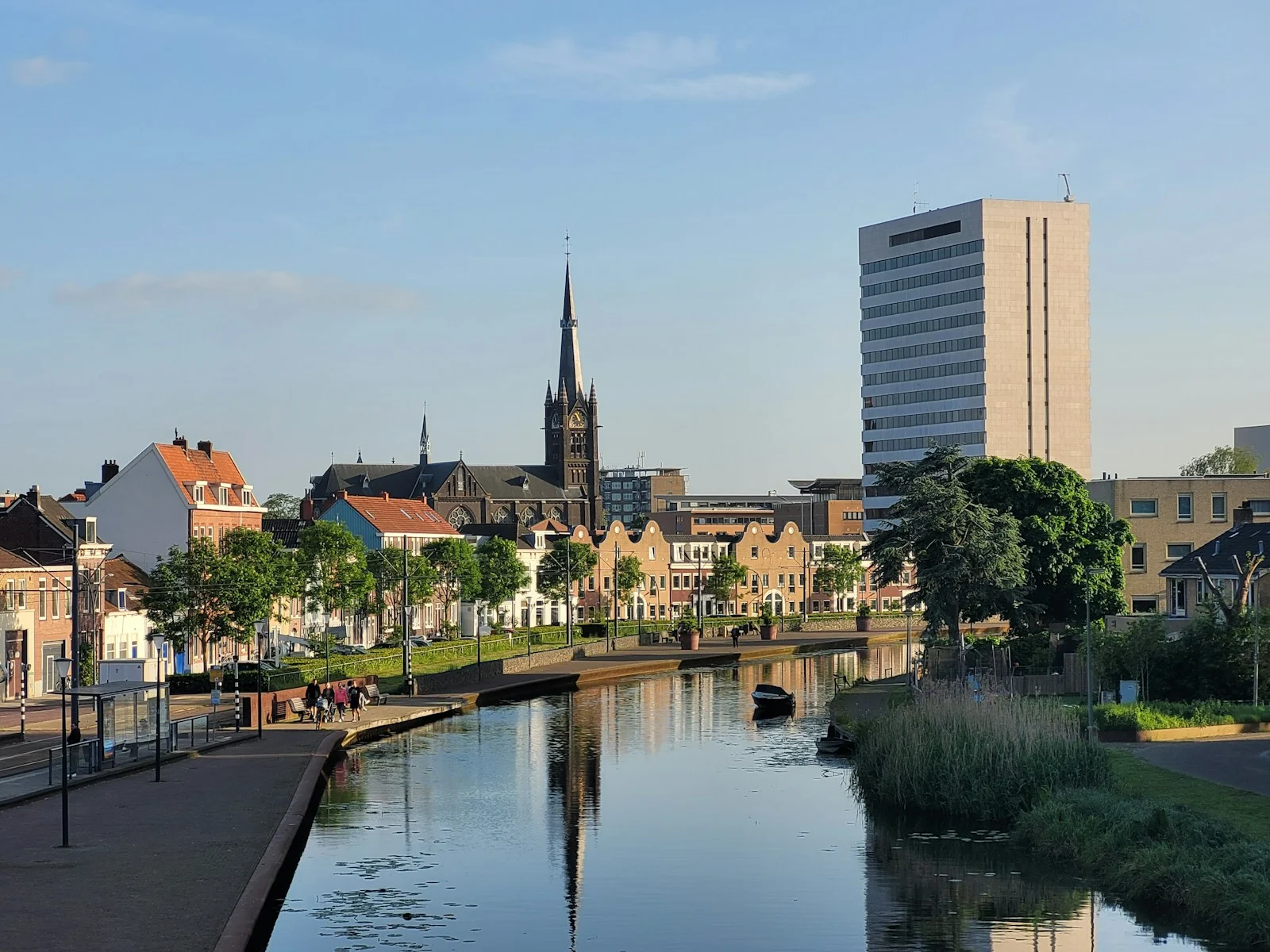 a river running through a city next to tall buildings